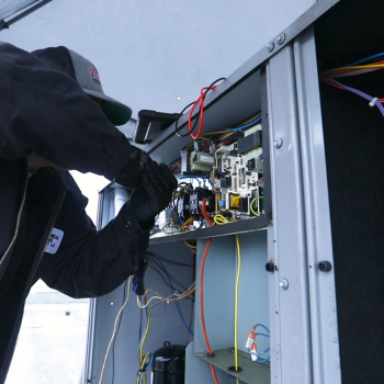 MSC technician working on HVAC, Mechanical System's Preventative Maintenance Approach